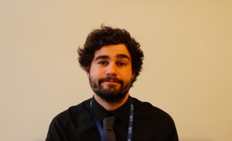 Image of trainee teacher Josh sat at his desk writing